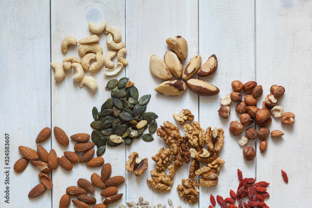 Different types of nuts, seeds, goji, divided in groups