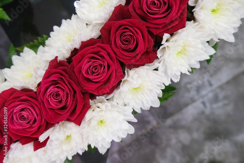 Roses and chrysanthemum  flowers arrangement  white and red roses  small cute flowers.