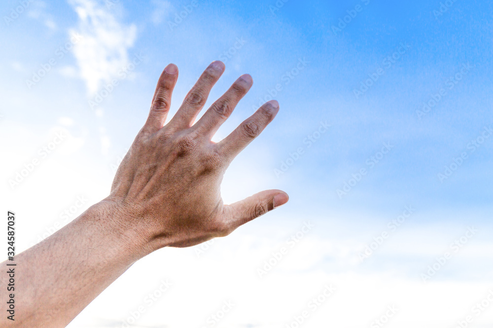 Man show hand up on sky protect from sunlight Man show hand up on sky protect from sunlight