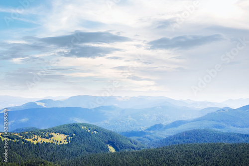 Beautiful mountain landscape. Distant mountains under a blanket of clouds_