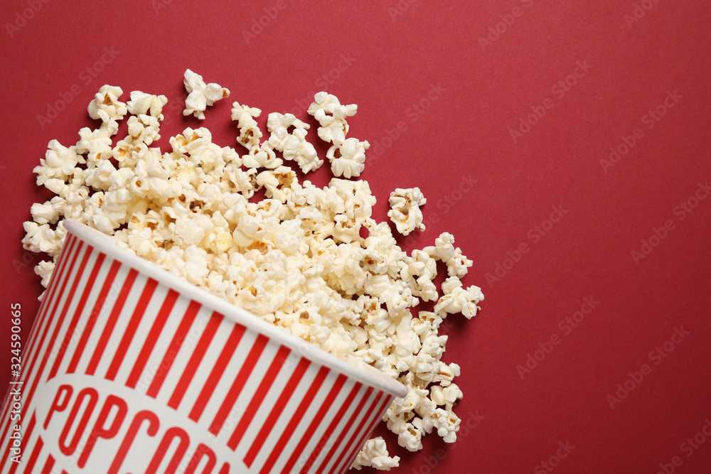Delicious popcorn on red background, top view Delicious popcorn on red background, top view