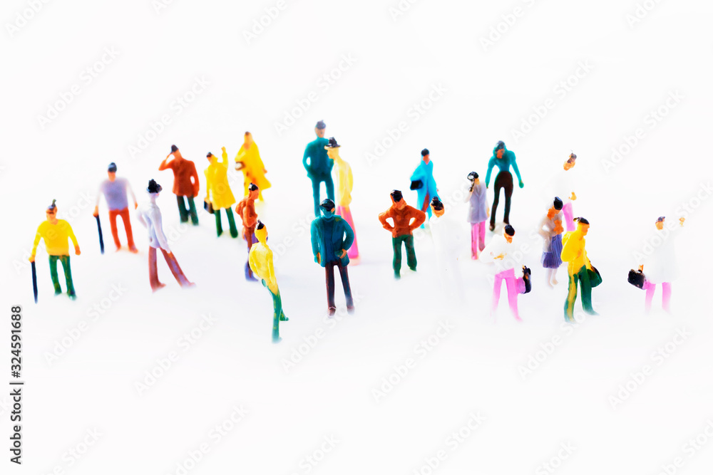 Many business people plastic toy on top of a white background, isolated, with out of focus figurines standing - Horizontal banner