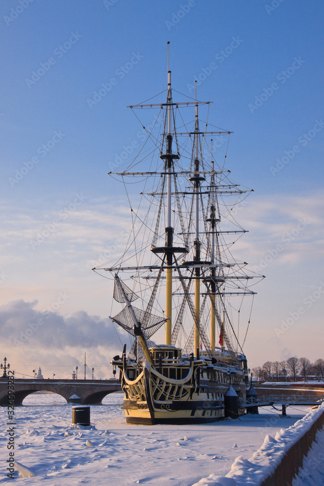 A frigate shackled by ice on the New, in the rays of the setting sun. A frigate shackled by ice on the New, in the rays of the setting sun.