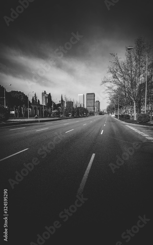 Passeo de la Castellana, a wide boulevard in central Madrid - monochrome photo