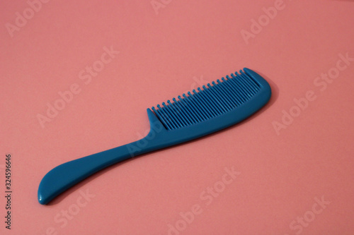 baby comb on a pink background  plenty of space available