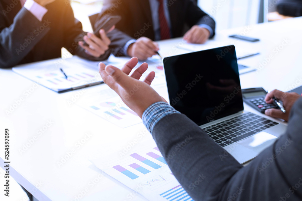 Businessman team is analyzing the cost of housing projects to live with lifestyle.business concept, soft focus, vintage tone Businessman team is analyzing the cost of housing projects to live with lifestyle.business concept, soft focus, vintage tone