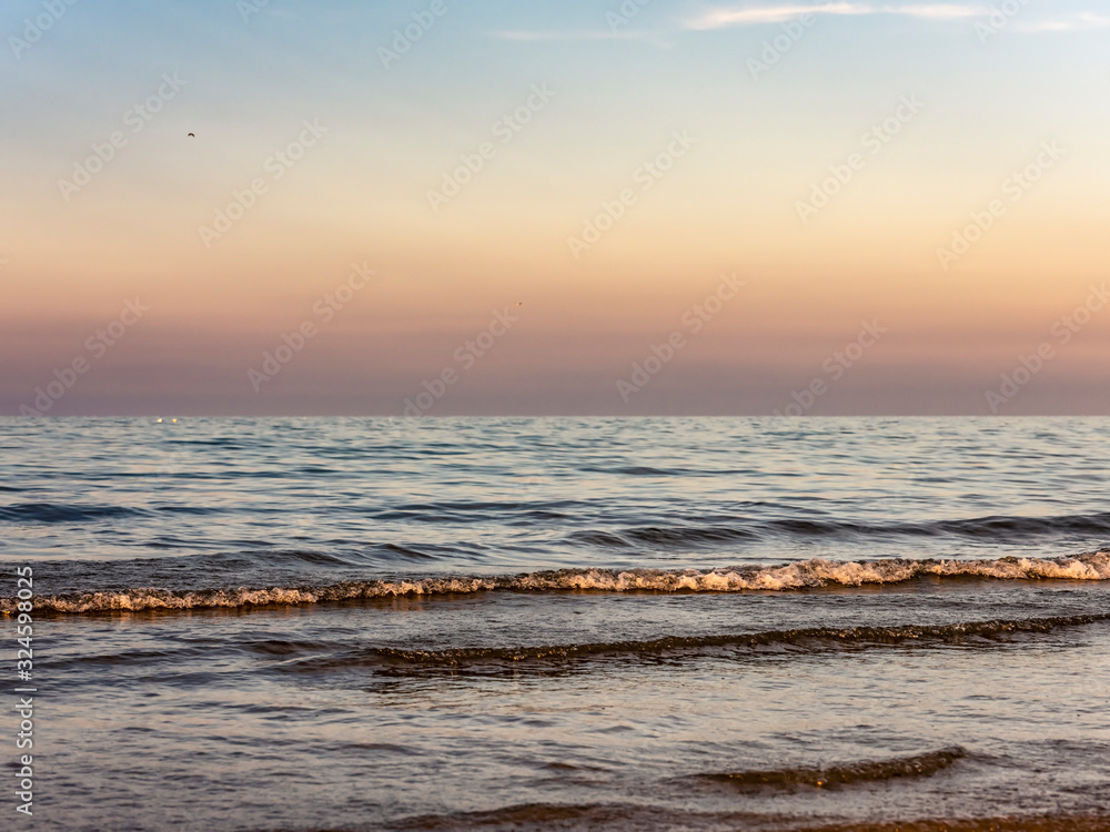 Obraz premium Calm sea at sunset