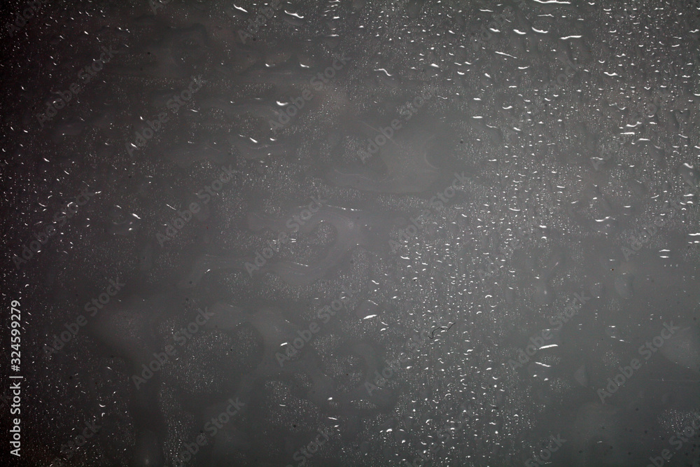 water drops on dark plastic background texture
