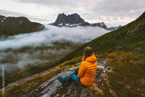 Woman relaxing alone in mountains travel adventure healthy lifestyle outdoor girl enjoying landscape in Norway hiking activity summer vacation