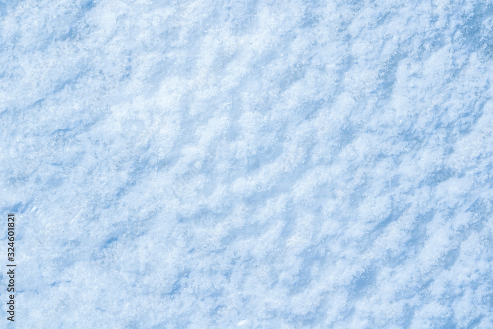 blue texture of an snow surface with pure white wave , blue cold clear cryslallized wall background ,decorative plaster background close up , abstract macro wallpaper