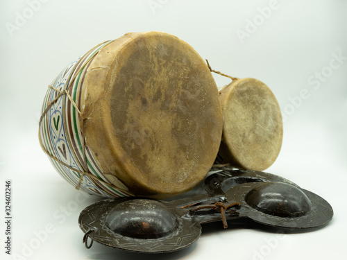 Krakebs and Moroccan bongos. Isolated traditional Moroccan instruments on a white background. Concept musical instrument. photo