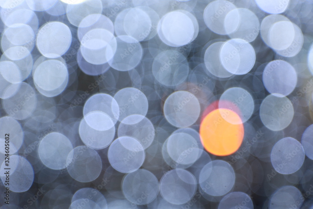 Diffused silver and white bokeh Black background at night Diffused silver and white bokeh Black background at night