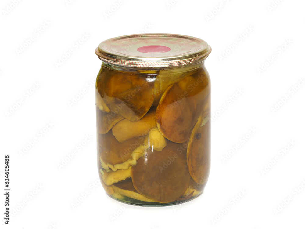 Glass jar with canned mushrooms on white a background. Glass jar with canned mushrooms on white a background.