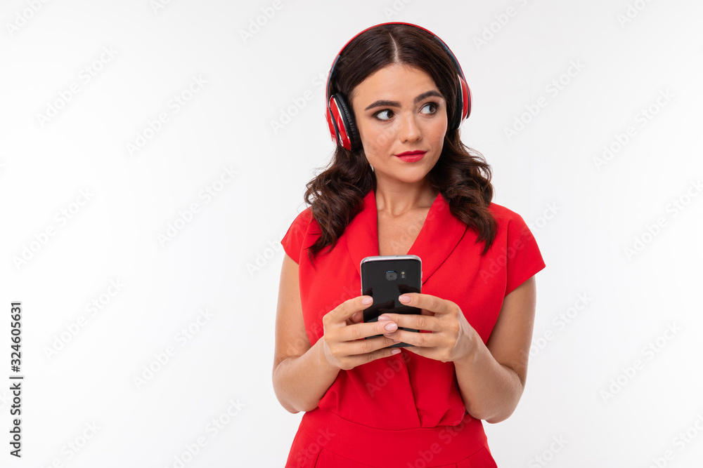 Portrait of nice caucasian girl with her smartphone isolated on white background Portrait of nice caucasian girl with her smartphone isolated on white background