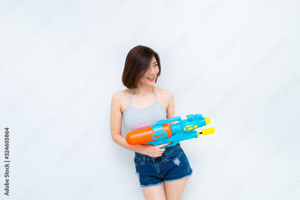 Asian sexy woman with gun water in hand on white background,Festival songkran day at thailand,The best of festival of thai,Land of smile Asian sexy woman with gun water in hand on white background,Festival songkran day at thailand,The best of festival of thai,Land of smile
