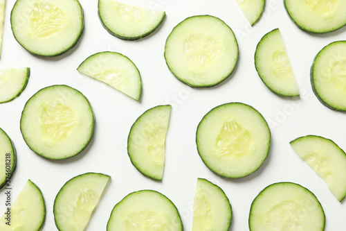 Fresh cucumber slices on white background, top view