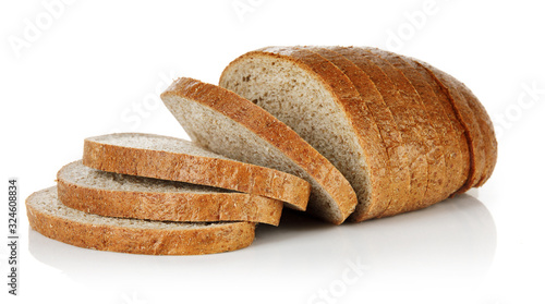 Wheaten bread with bran cut slice. Baking of dough. Isolated on white background. photo