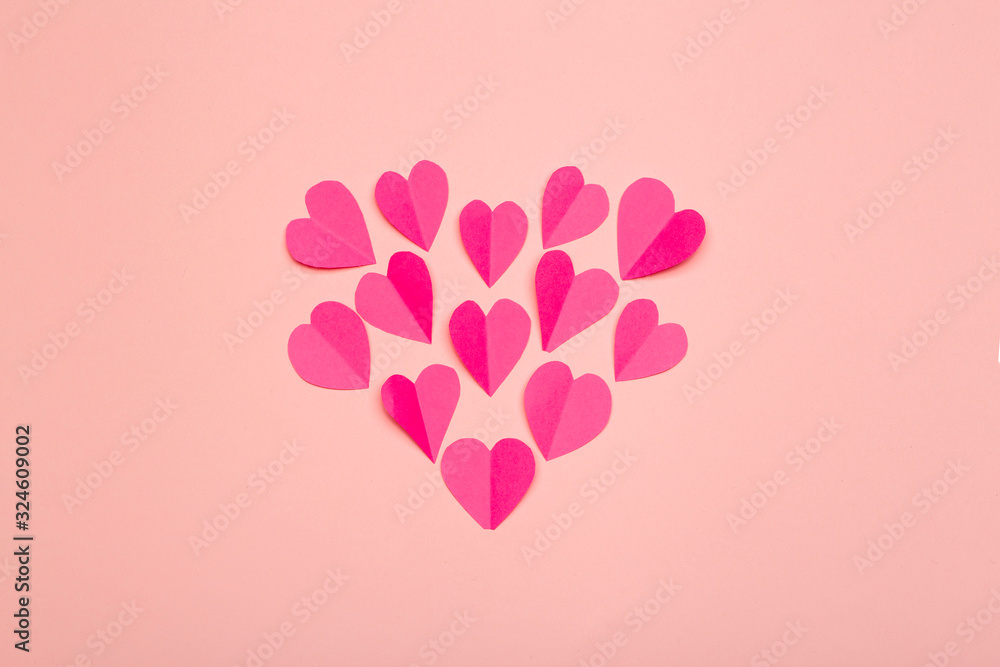 Love (Valentine's day) background or wedding background. Pink paper hearts on a pink pastel background. Love concept