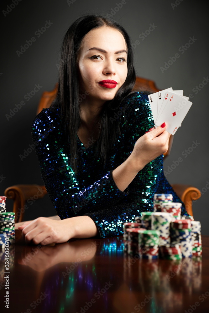 Casino. Portrait of pretty young woman holding playing cadrs in her hand. Casino. Portrait of pretty young woman holding playing cadrs in her hand.