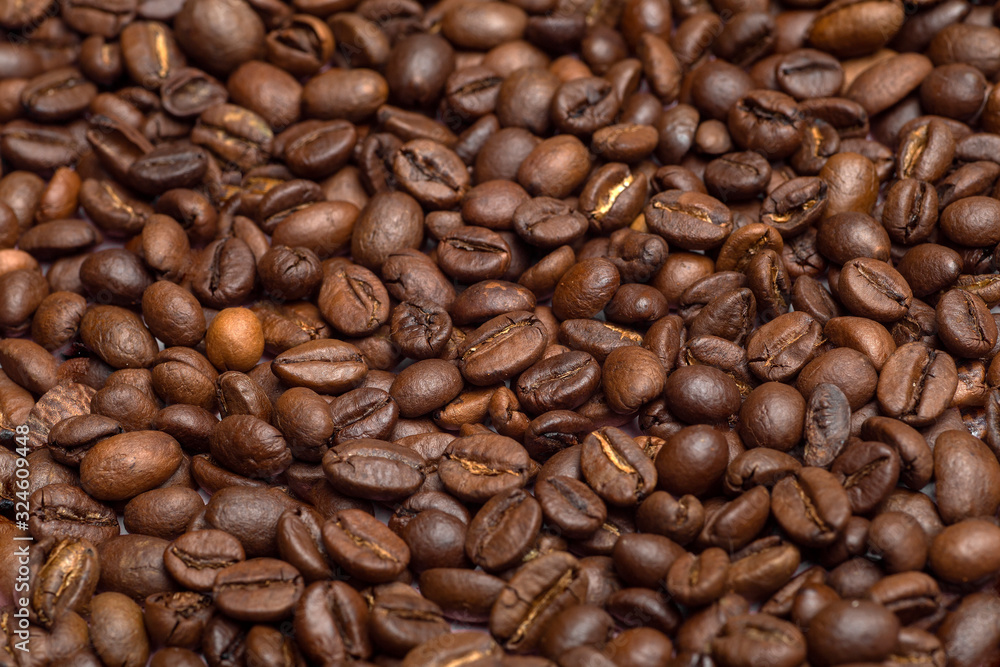 Coffee beans background. Coffee beans close up on the table. Coffe concept