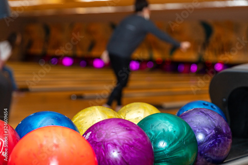 Colorful and vibrant bowling balls  with lanes in the background  with copy space