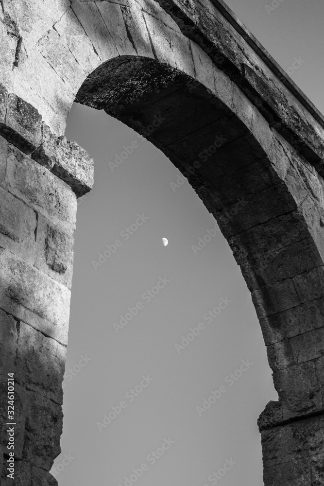 roman aqueduct tarragona.Roman aqueduct with arches at sunset.Close up of aqueduct