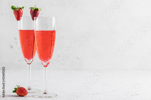 Strawberry party drinks in champagne glasses. Selective focus, copy space.