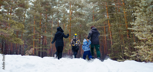 family in winter forest