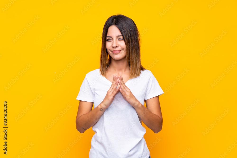 Young woman over isolated yellow background scheming something Young woman over isolated yellow background scheming something