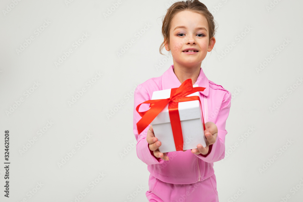 joyful happy caucasian girl received a birthday present on a white background with copy space joyful happy caucasian girl received a birthday present on a white background with copy space