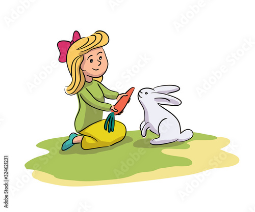 Little girl giving carrot cute rabbit on farm yard