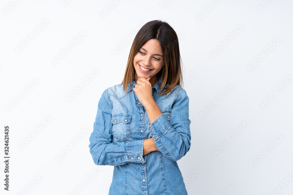 Young woman over isolated white background looking to the side
