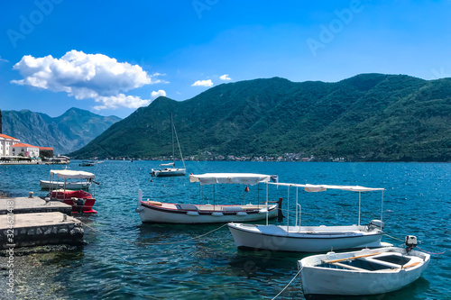 small yachts and boats stand on the shore of the city of Perast Kotor Bay Montenegro, Adriatic Sea. Summer 2019