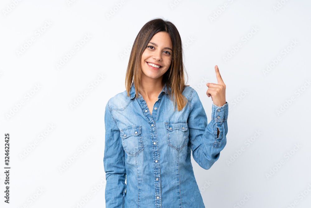 Young woman over isolated white background showing and lifting a finger in sign of the best Young woman over isolated white background showing and lifting a finger in sign of the best