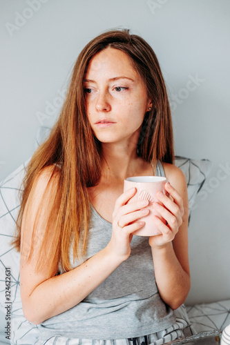 Woman having her breakfast in bed