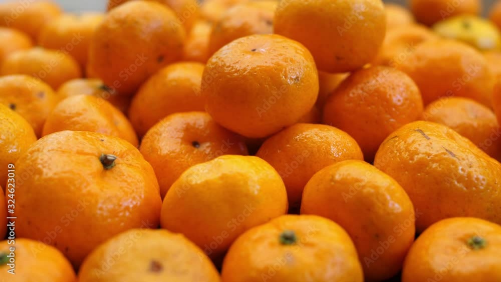 Heap Of Ripe Tasty Orange Tangerines. Camera Rotates. Christmas And New Year Holidays Concept Heap Of Ripe Tasty Orange Tangerines. Camera Rotates. Christmas And New Year Holidays Concept