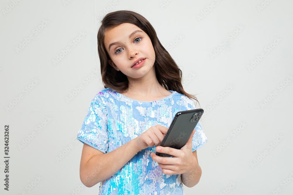 girl with a smartphone in her hands girl with a smartphone in her hands