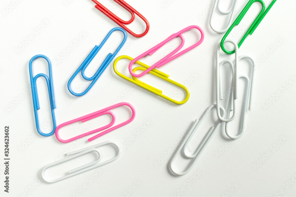 Colorful paper clips isolated on white close-up view. Colorful paper clips isolated on white close-up view.