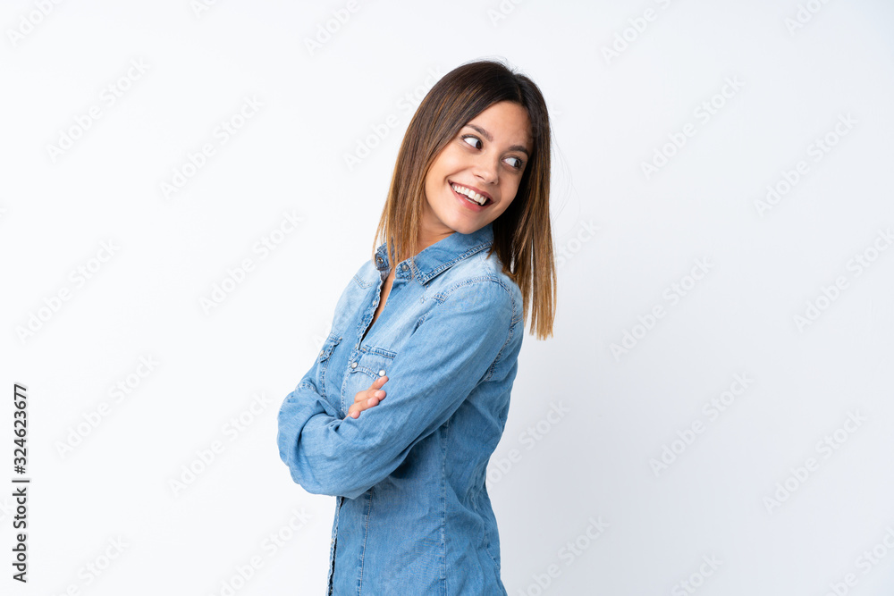 Young woman over isolated white background with arms crossed and happy Young woman over isolated white background with arms crossed and happy