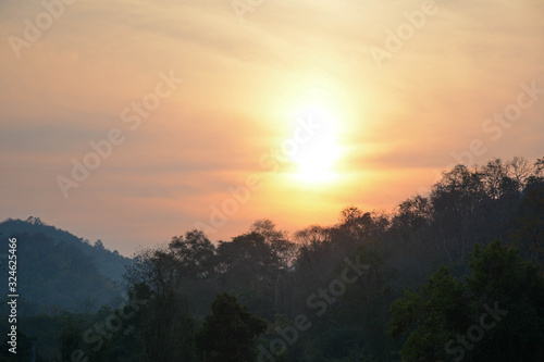 Nature sunset The rural landscape under the colorful sky at sunset The sun is beyond the horizon, warm tones in the horizon