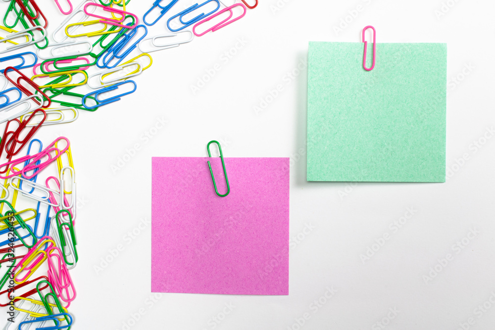 Colorful paper clips and note papers isolated on white. Colorful paper clips and note papers isolated on white.