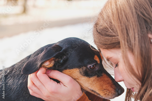 Canvastavla Loving and adoring dogs: woman with her puppy