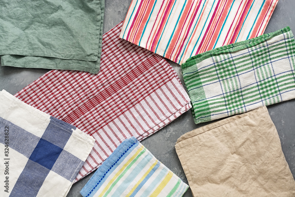 Fototapeta premium Background from kitchen towels and napkins, flat lay. View from above.