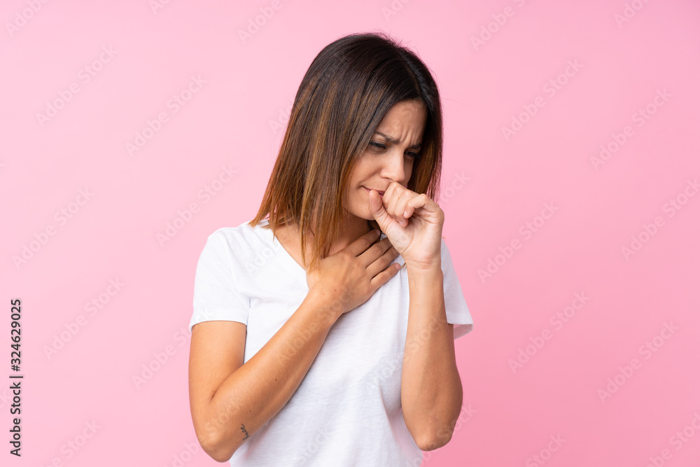 Young woman over isolated pink background is suffering with cough and feeling bad Young woman over isolated pink background is suffering with cough and feeling bad