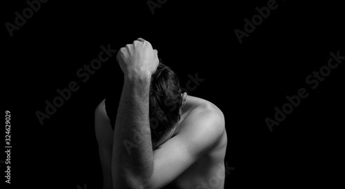 black and white dramatic photo in a depressed pose