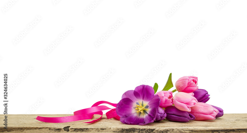 Pink tulips bouquet with ribbon on wooden Board isolated on white background, copy space Pink tulips bouquet with ribbon on wooden Board isolated on white background, copy space