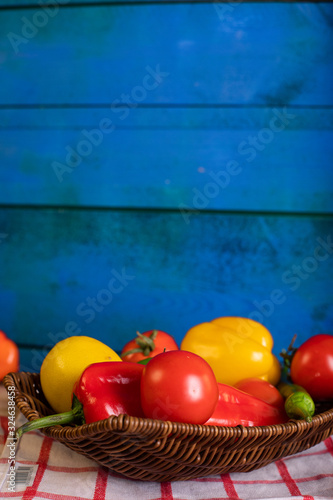 Tomato and peppers platter on blue background