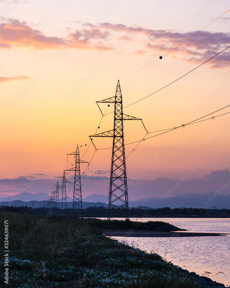 Power Lines at sunset on lake
