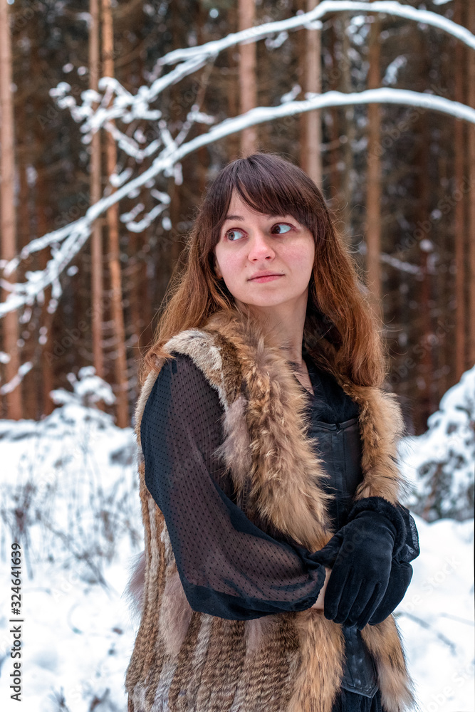 Portrait of a girl in a wintery forest Portrait of a girl in a wintery forest