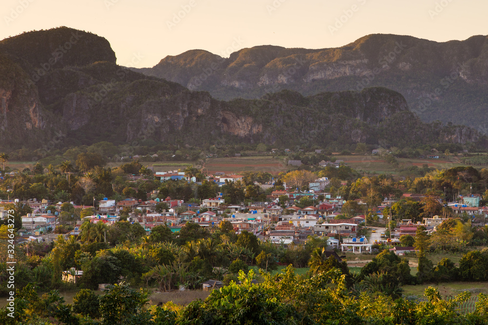 Aerial view of the town of Vinales in its valley surrounded by karstic mountains at dusk, Pinar del Rio Province, Cuba